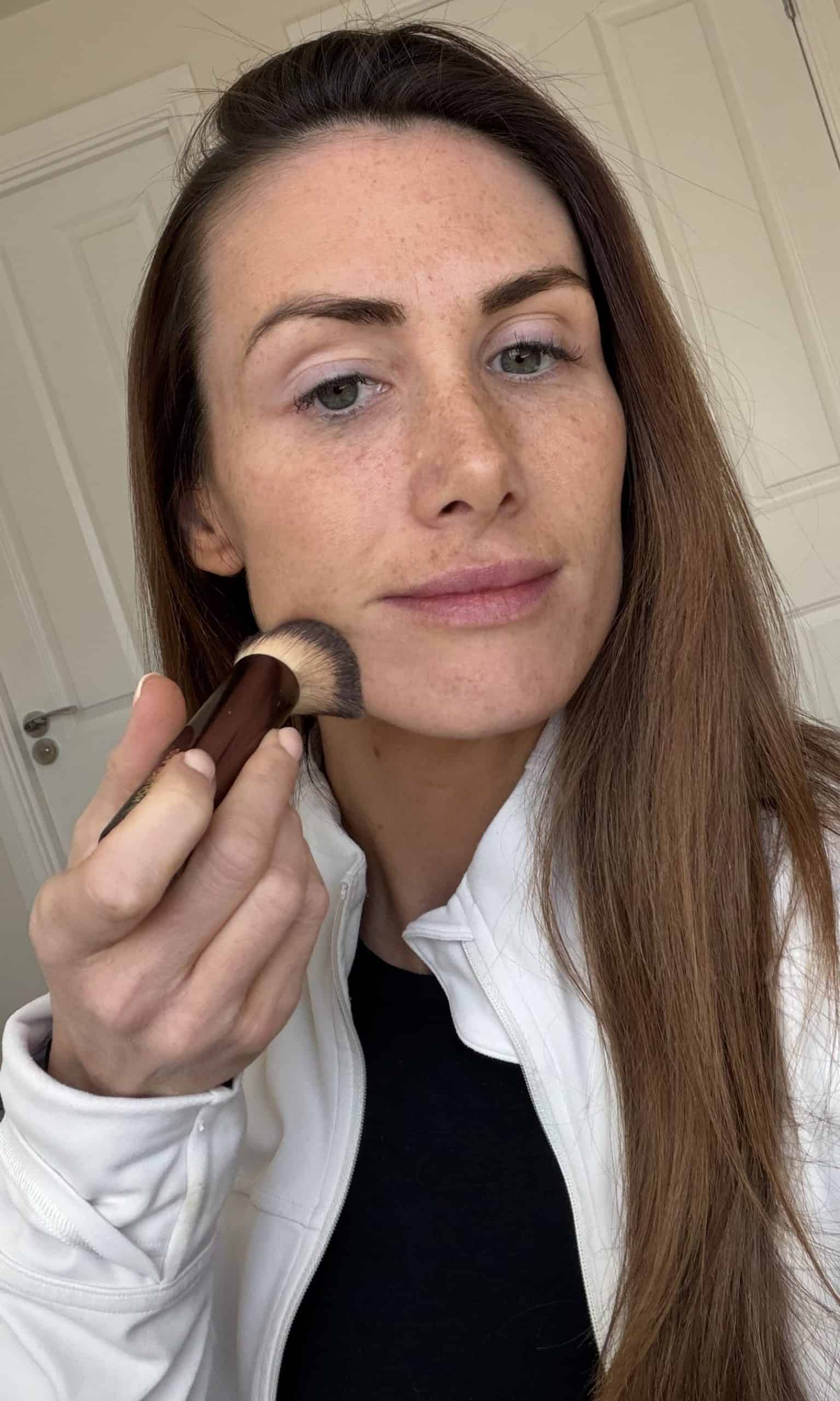 applying Laura Mercier foundation with the hourglass foundation brush