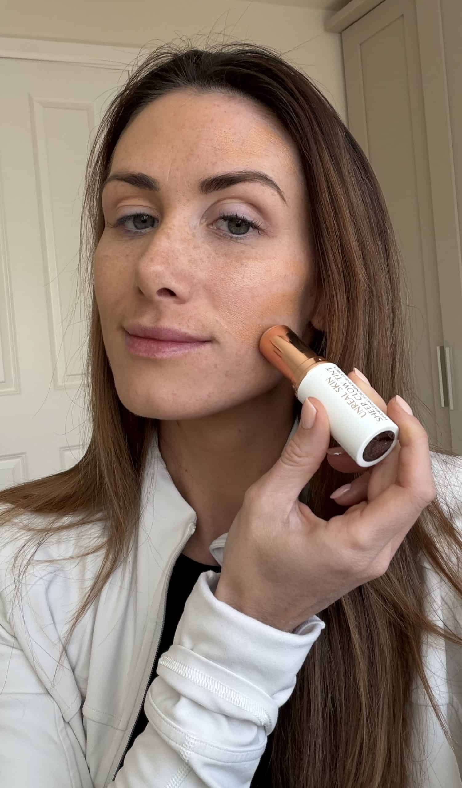 applying the Charlotte tilbury skin tint stick