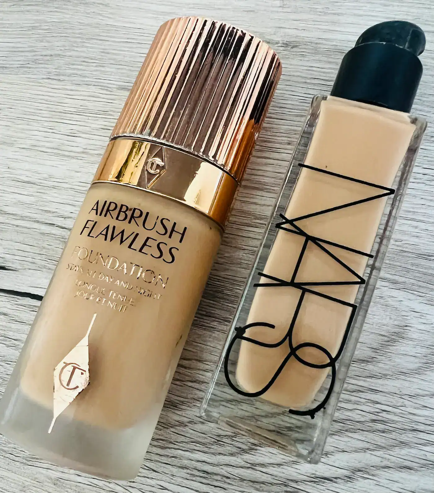 Charlotte tilbury airbrush flawless foundation and NARS Radiant Longwear foundation Charlotte Tilbury Airrbrush Flawless foundation bottle and NARS Radiant Longwear foundation bottle